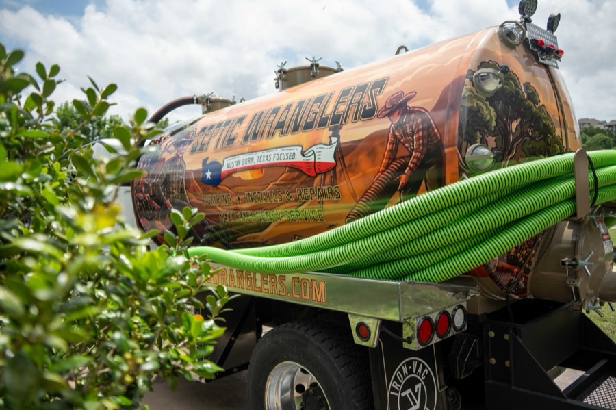 Septic Wranglers team with the Freightliner truck